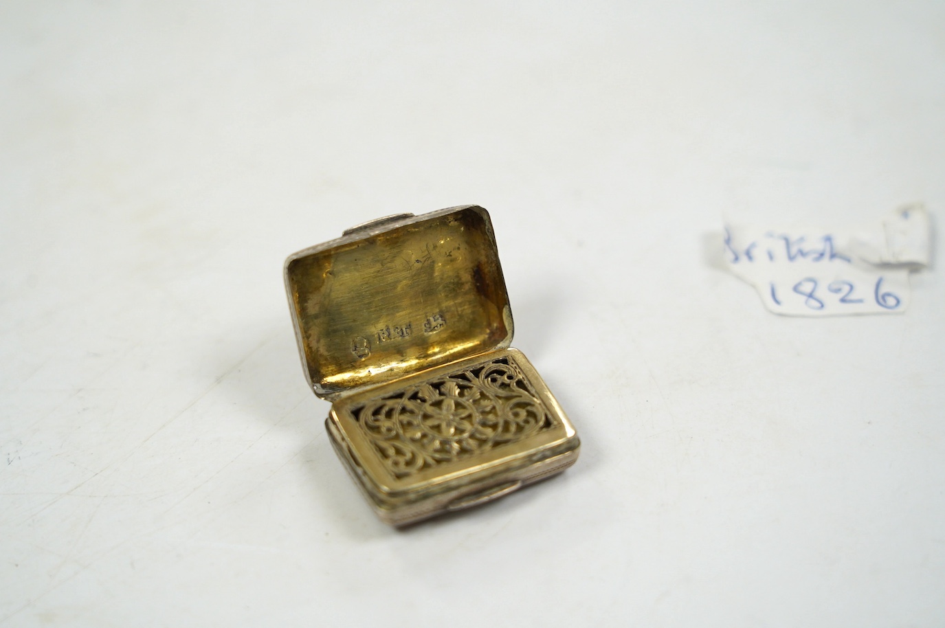 A group of small silver, including a George IV vinaigrette, shaving brush holder, etc. and a Dutch white metal snuff box. Condition - poor to fair